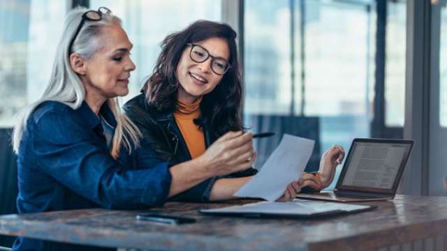 two ladies making notes