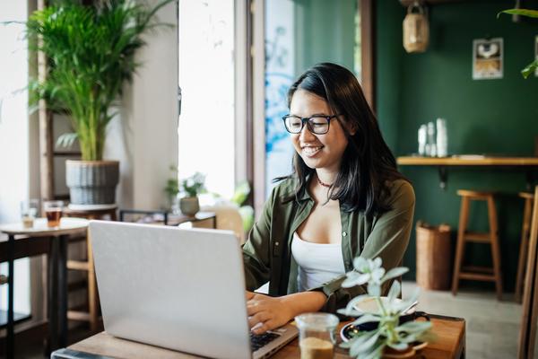 Woman looking at webinar